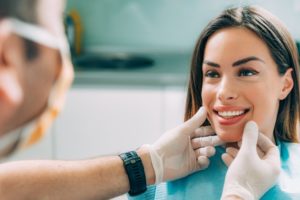 Woman Smiling at Dentist 1595968418 82136 300x200 1 - Distinctive Dentistry