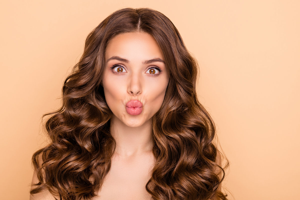 Close-up portrait of her she nice-looking attractive lovely gorgeous, cheerful funny well-groomed wavy-haired girl sending air kiss perfect lips line isolated over beige pastel color background